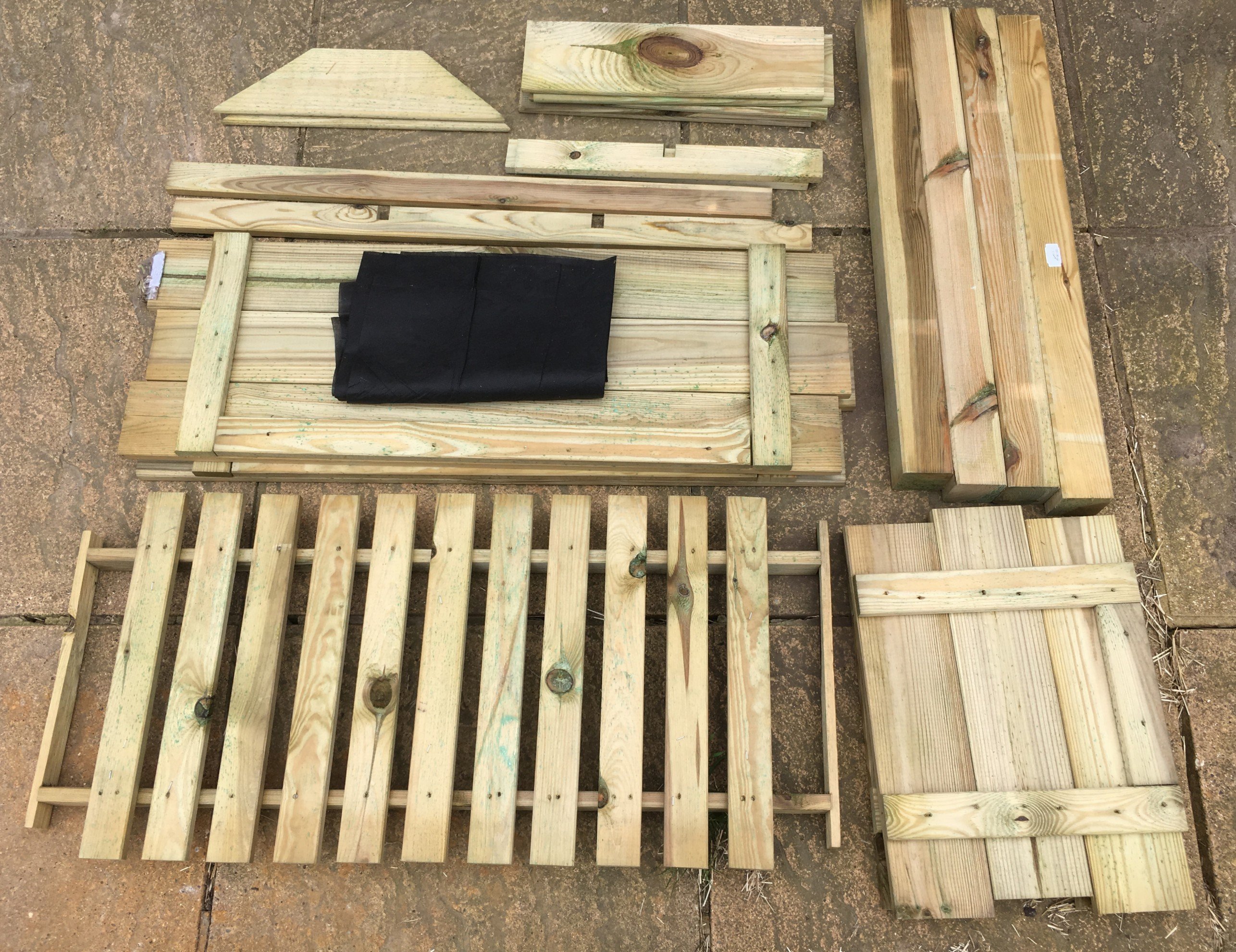 An image of all the parts of the planter pre- assembly
