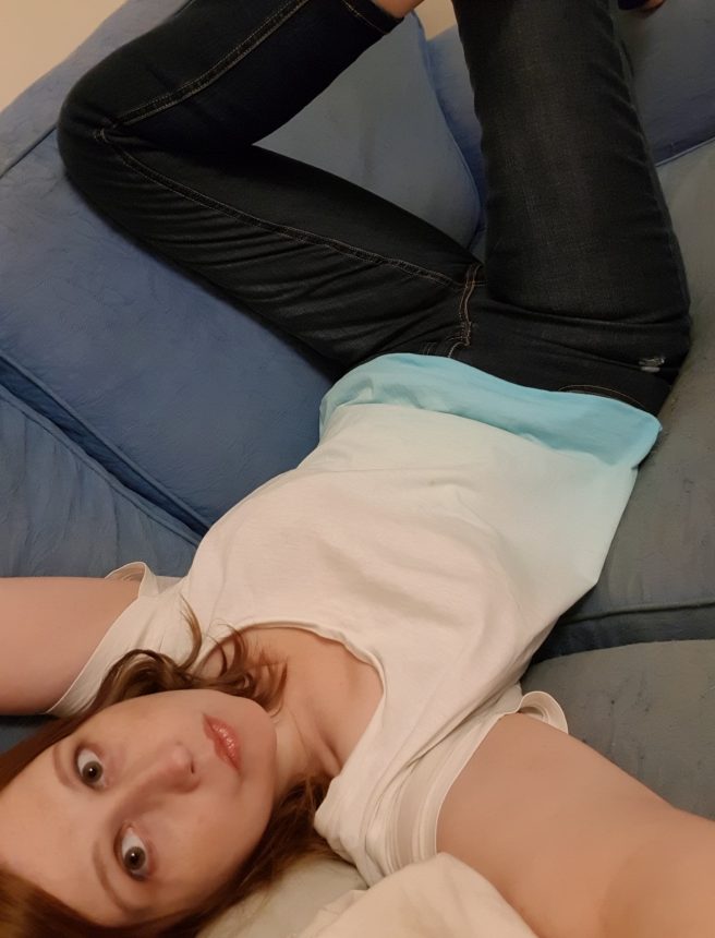 Lazing on sofa in jeans