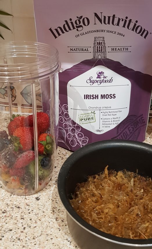 Indigo Herbs Irish moss. Image is Irish Moss, Indigo Herbs packet and fruit in smoothie container. 