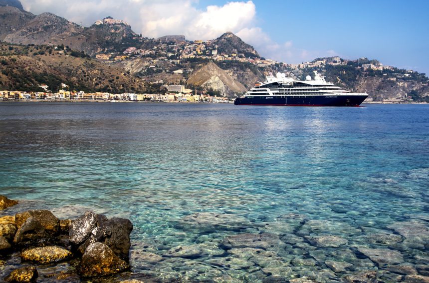 Picture of cruise ship in the sea with beautiful scenery